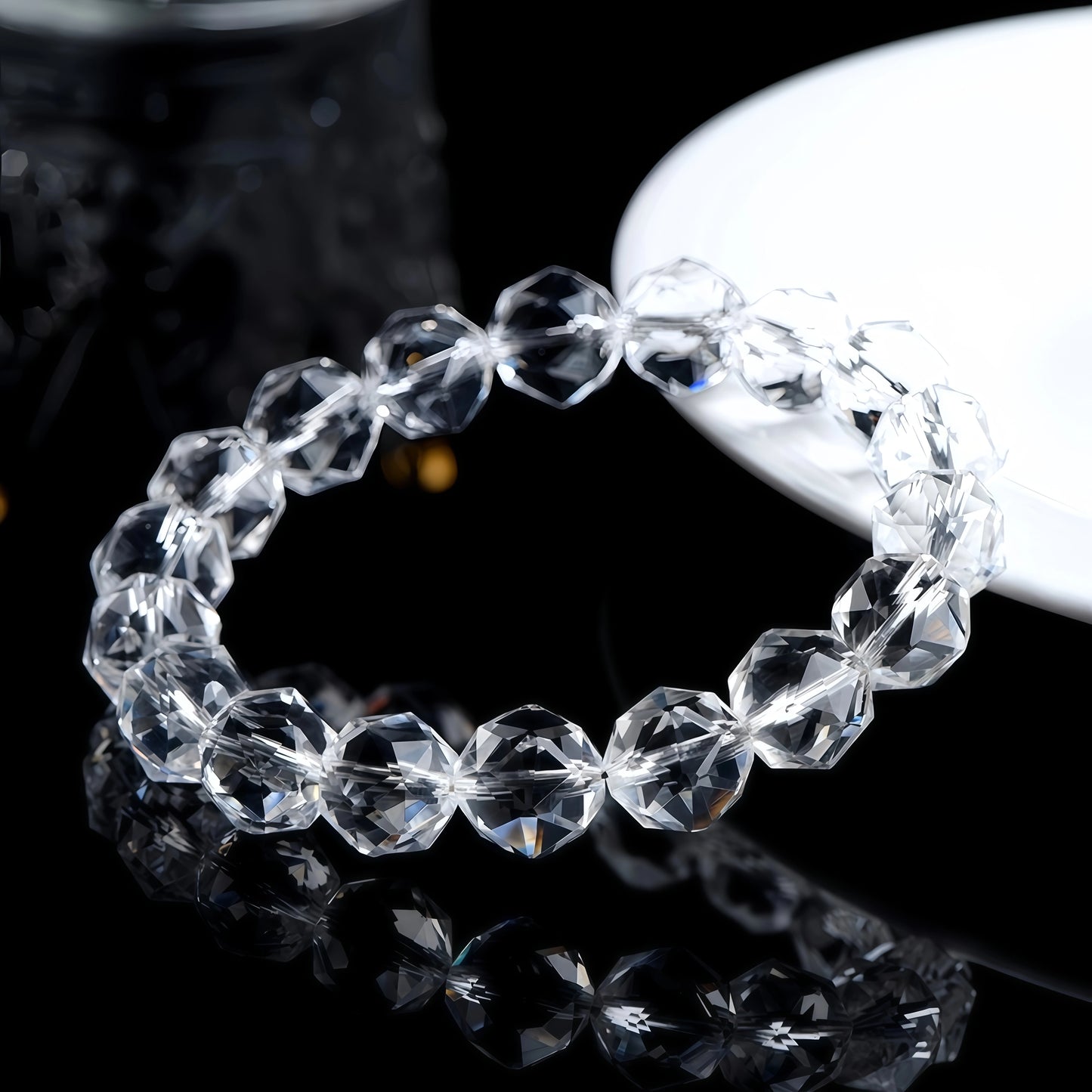 Faceted clear quartz bracelet shown from another angle, catching the light