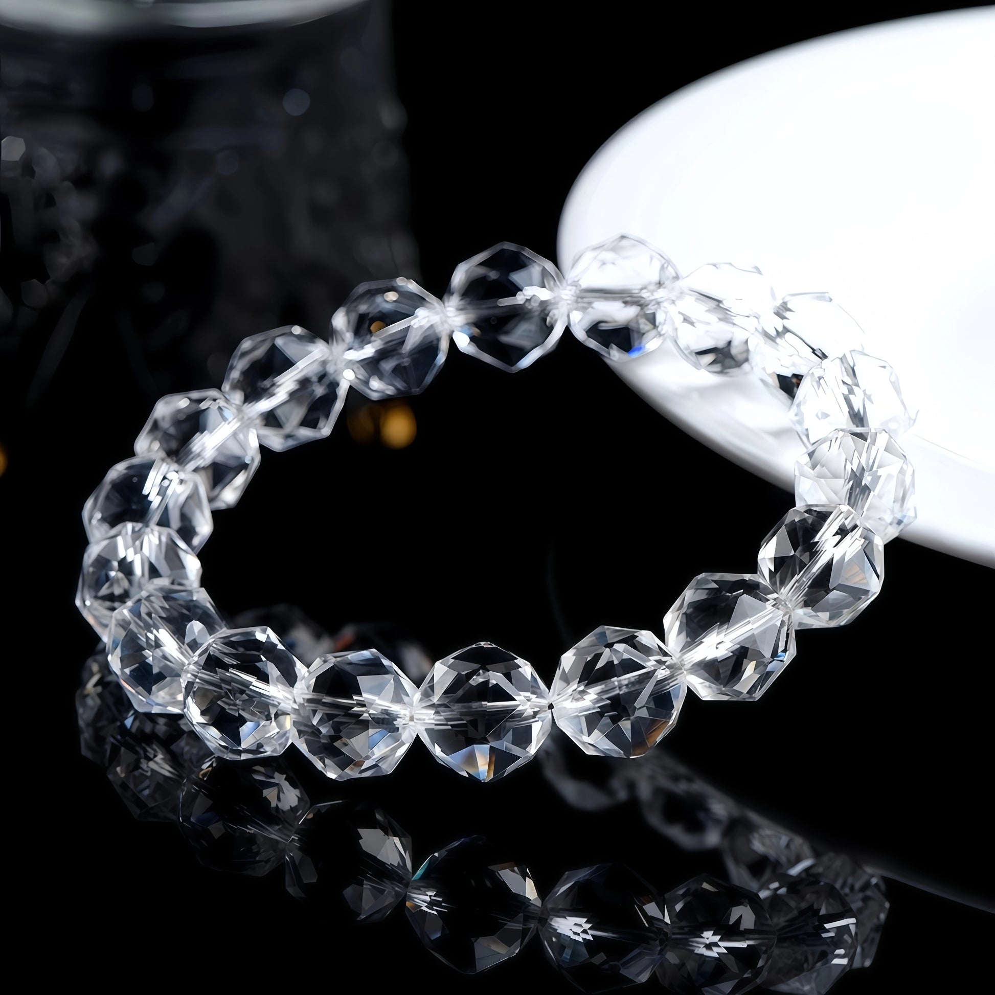 Faceted clear quartz bracelet shown from another angle, catching the light