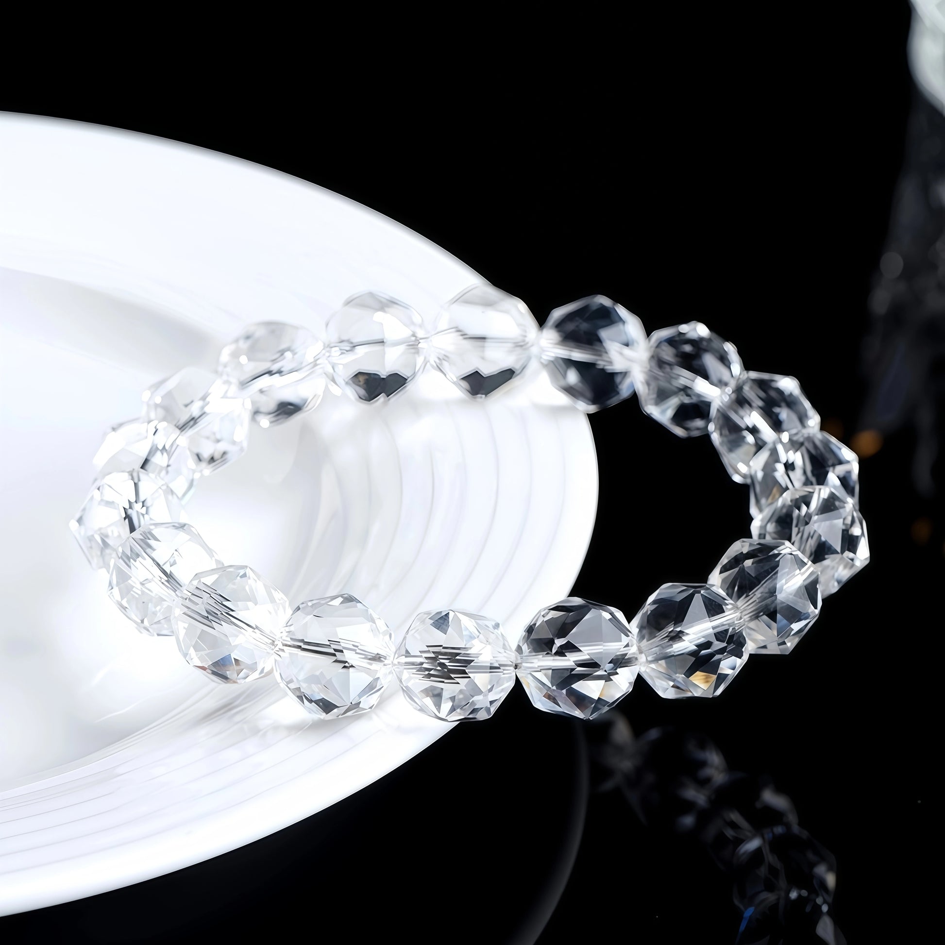 Close-up of diamond-faceted clear quartz beads showing their sparkle and clarity