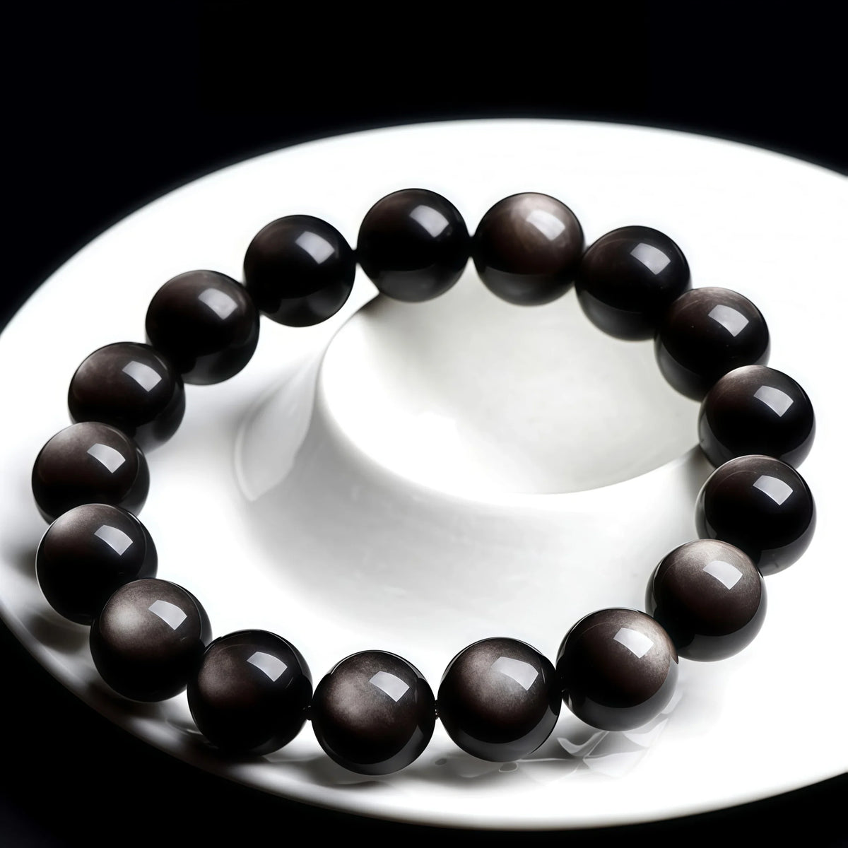 Genuine Volcanic Black Obsidian Stone Bracelet on Ceramic Display