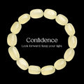 Handcrafted pale yellow natural crystal bead bracelet on a black background with text.