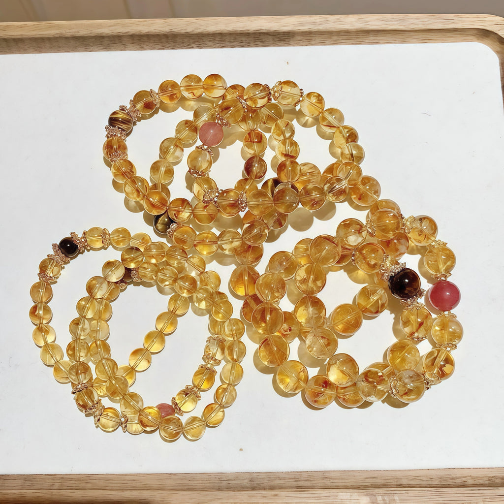 Authentic golden phantom healing crystal jewelry displayed on natural background