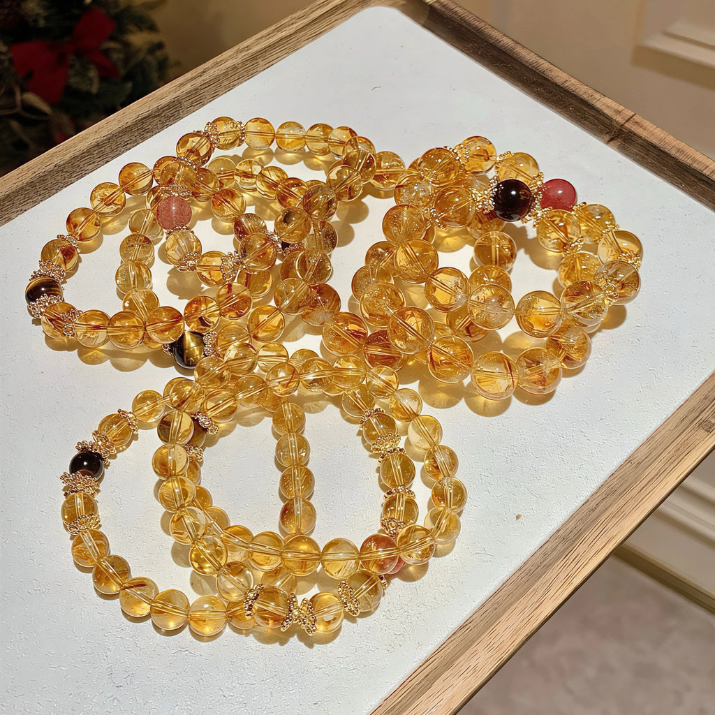 Close-up of genuine Yellow Phantom Quartz crystal beads showing golden pyramid inclusions